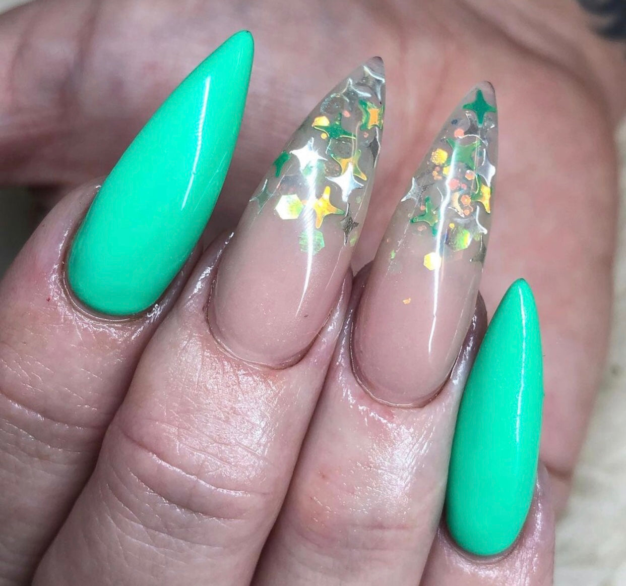 encapsulated star glitter in gold and green