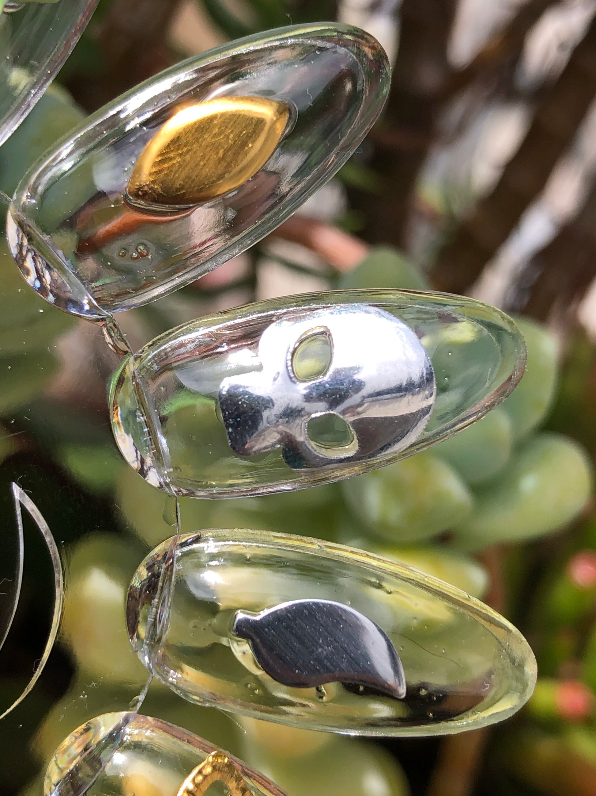 nail charms in gold and silver