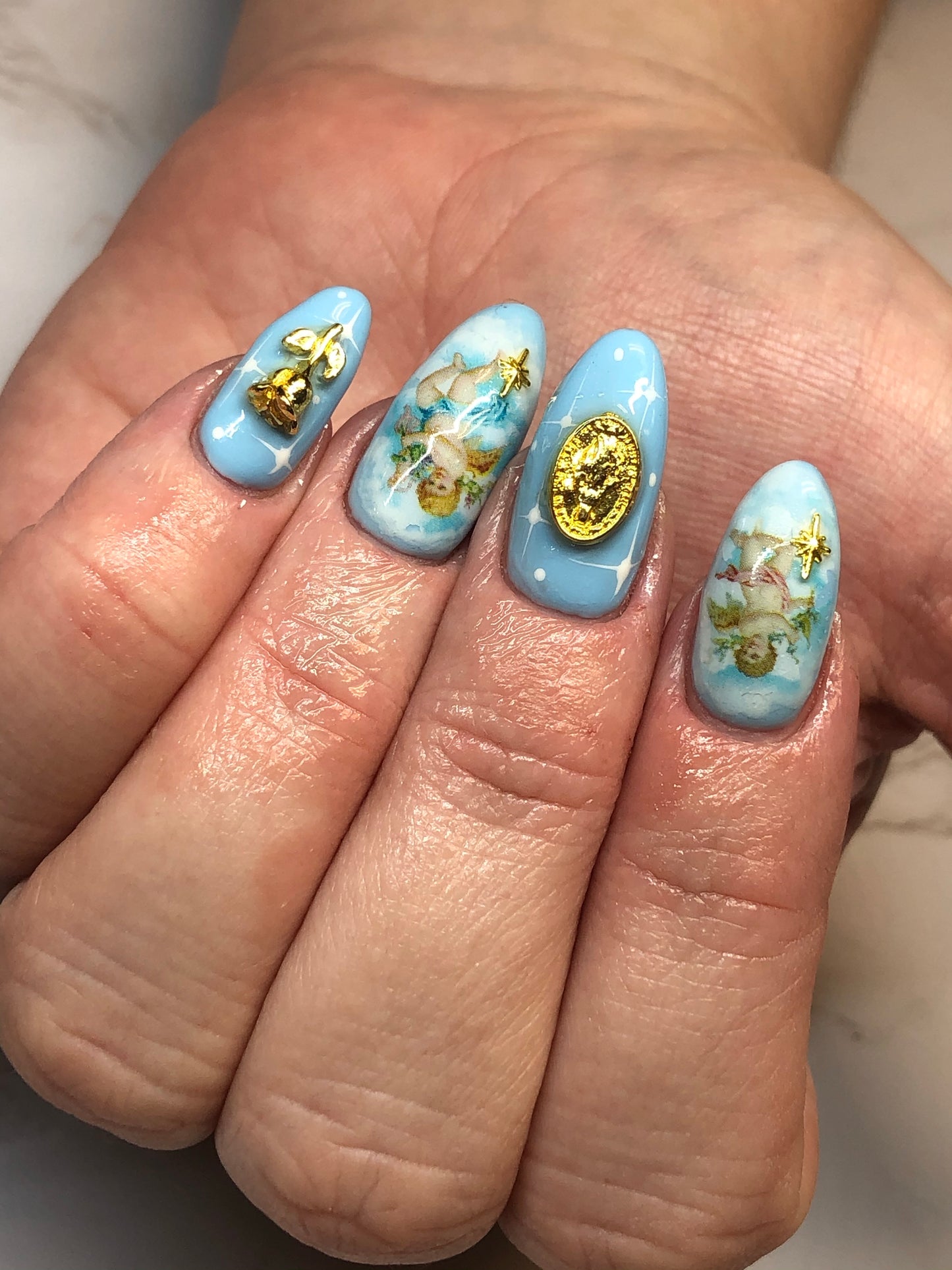 blue cherub angel nail art with charms