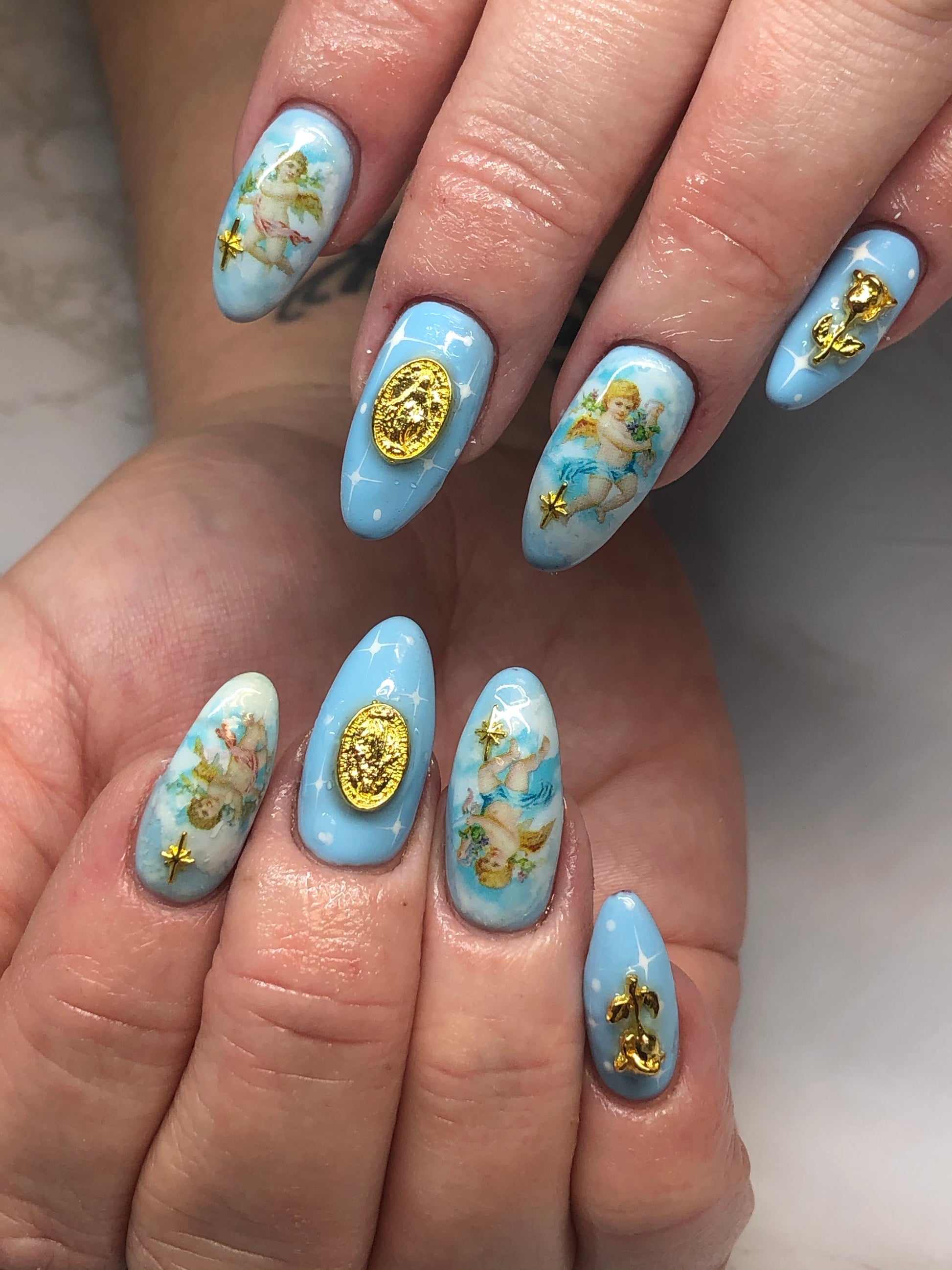 blue cherub angel nail art with charms